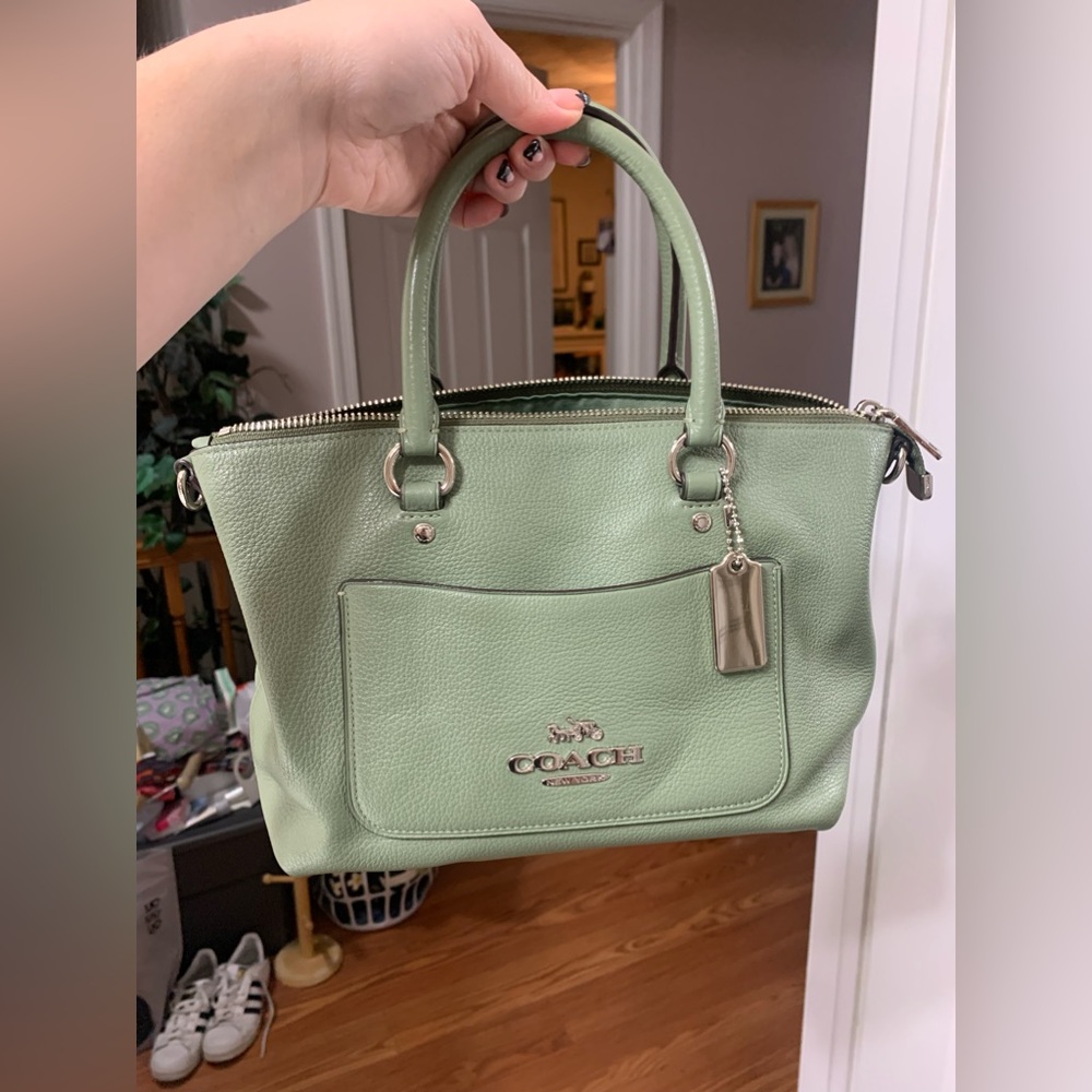 Light sage green Coach purse with crossbody strap
